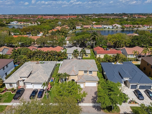 bird's eye view with a residential view and a water view