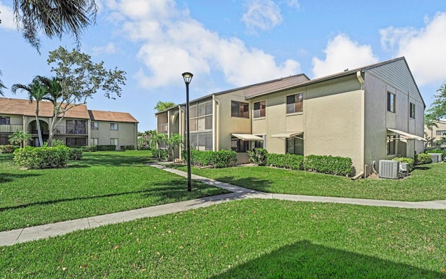 view of property featuring a residential view and central AC