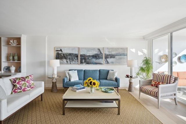 living room with wood finished floors and baseboards