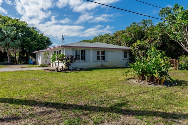 view of home's exterior with a yard