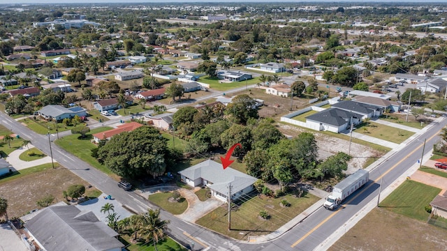 birds eye view of property with a residential view