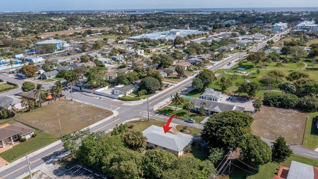 birds eye view of property with a residential view