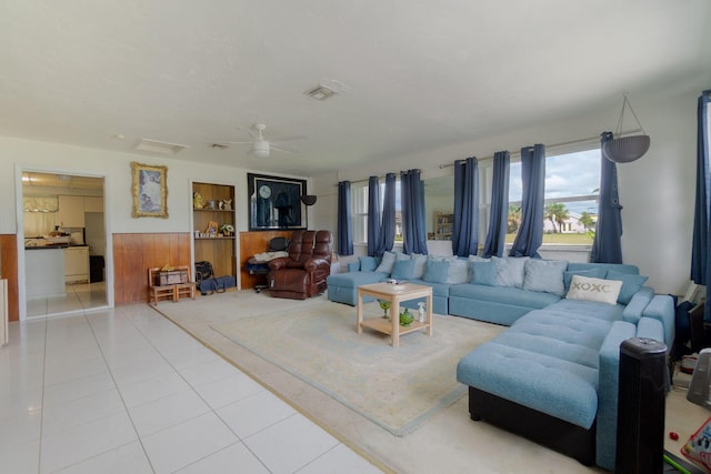 living room featuring ceiling fan, tile patterned flooring, and visible vents