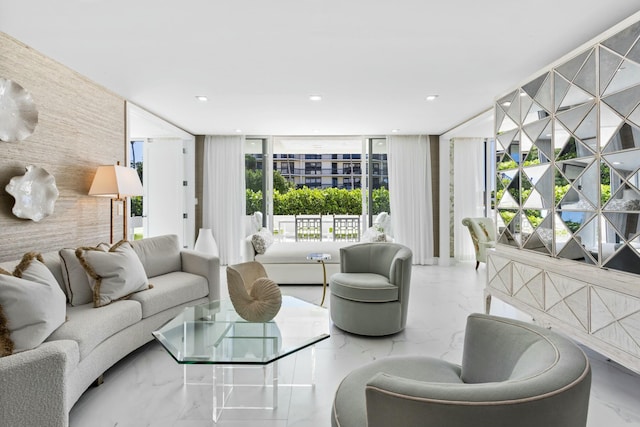 living room featuring recessed lighting and marble finish floor