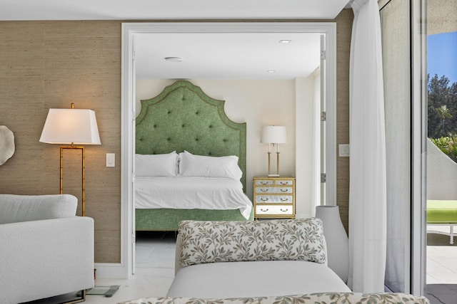 bedroom featuring multiple windows and marble finish floor