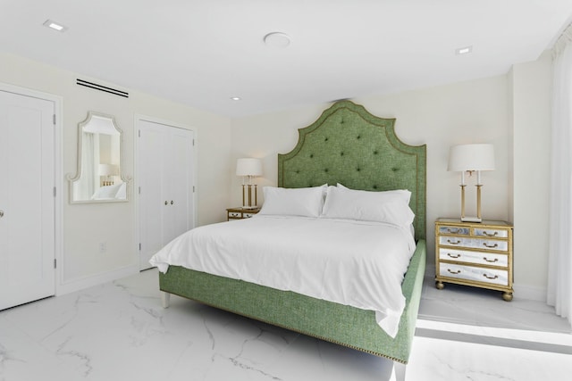 bedroom featuring baseboards and marble finish floor