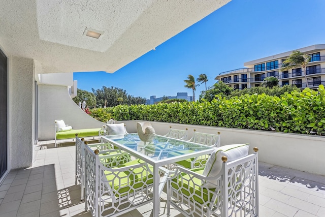 balcony featuring outdoor dining area