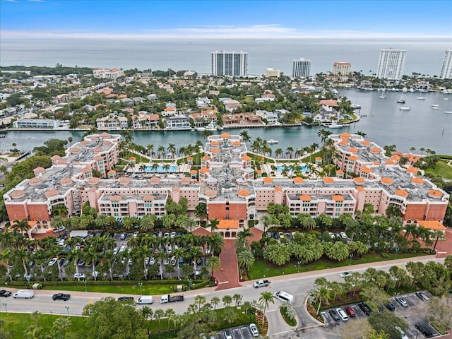 drone / aerial view featuring a water view and a city view