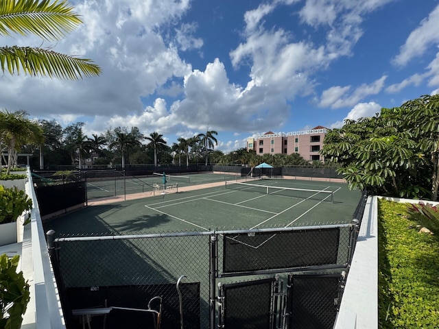 view of sport court featuring fence