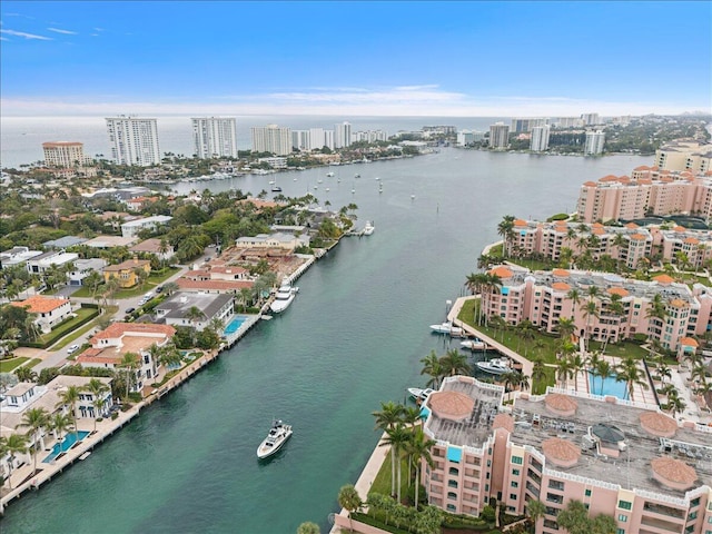 aerial view featuring a city view and a water view