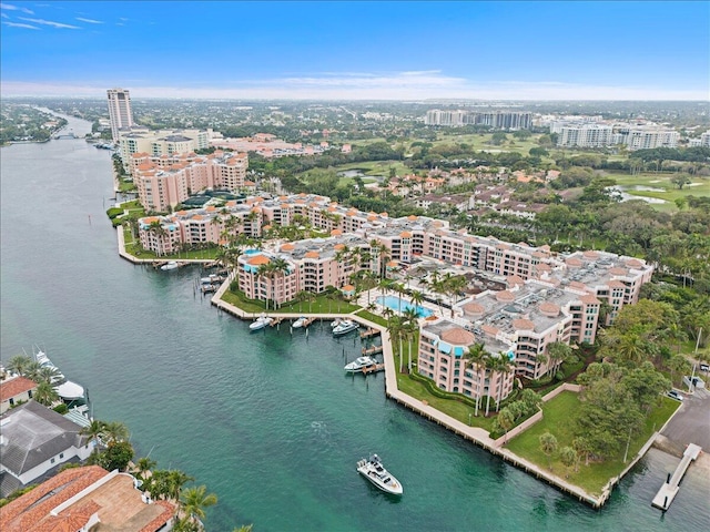 birds eye view of property with a view of city and a water view