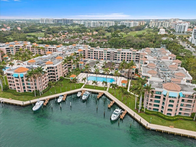 birds eye view of property featuring a view of city and a water view