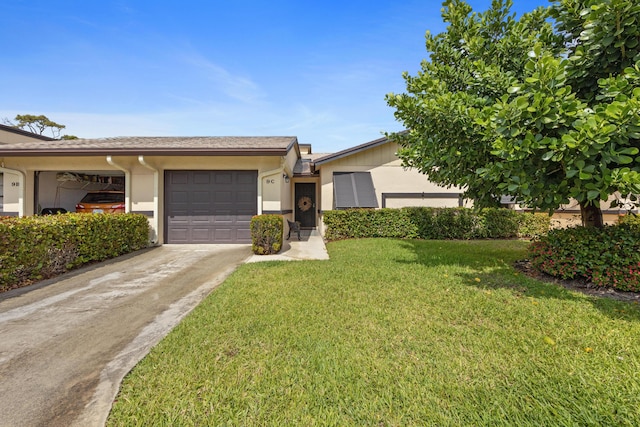 single story home featuring stucco siding, a front lawn, concrete driveway, and an attached garage