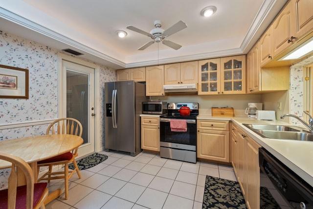 kitchen featuring visible vents, light brown cabinets, wallpapered walls, stainless steel appliances, and a sink