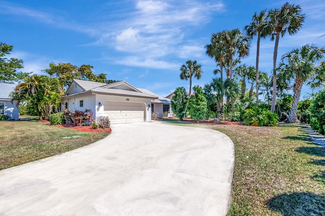 ranch-style house featuring stucco siding, a front yard, concrete driveway, and an attached garage