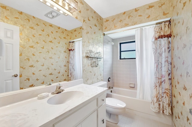 full bathroom featuring wallpapered walls, toilet, vanity, and shower / bath combo with shower curtain