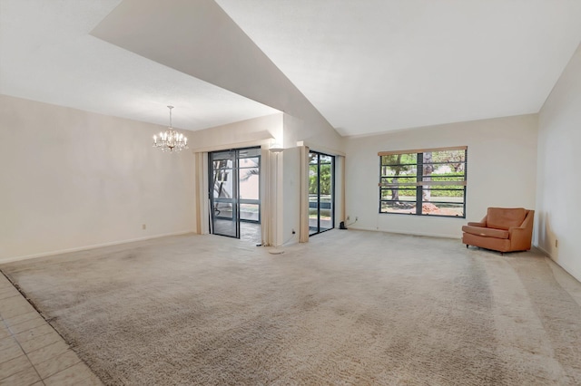 unfurnished living room with light carpet, baseboards, lofted ceiling, and an inviting chandelier