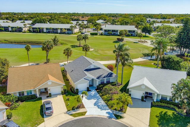 aerial view featuring a residential view, golf course view, and a water view