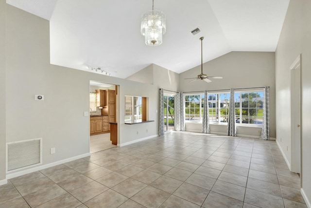 unfurnished living room with light tile patterned floors, ceiling fan with notable chandelier, visible vents, and baseboards