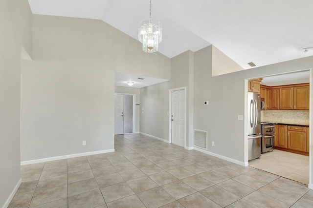 interior space featuring visible vents, baseboards, an inviting chandelier, and light tile patterned flooring