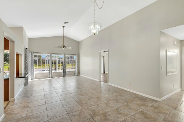 unfurnished room with visible vents, high vaulted ceiling, ceiling fan with notable chandelier, light tile patterned floors, and baseboards