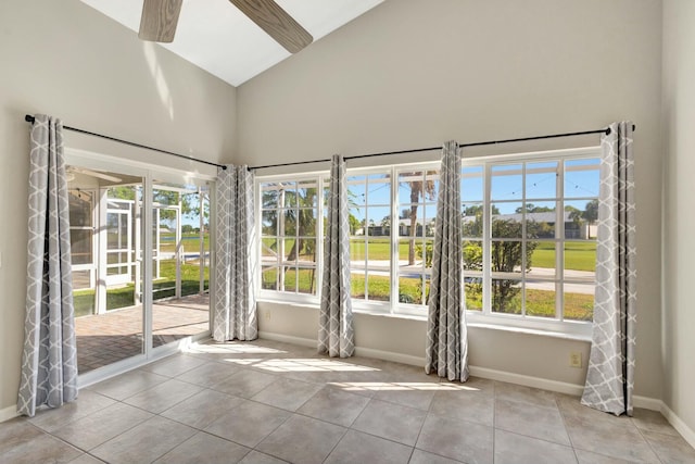 interior space featuring lofted ceiling and a ceiling fan