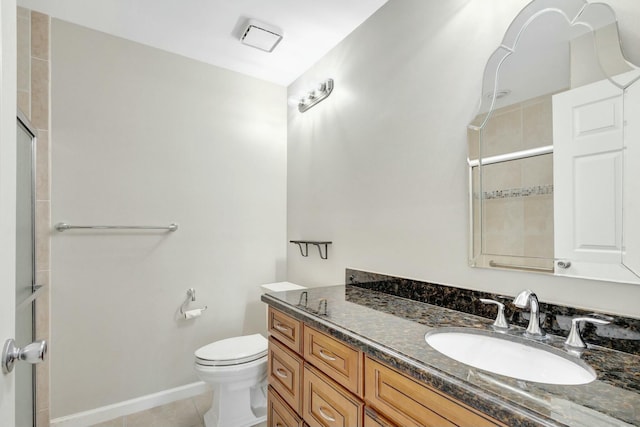 full bathroom with toilet, tiled shower, tile patterned flooring, baseboards, and vanity