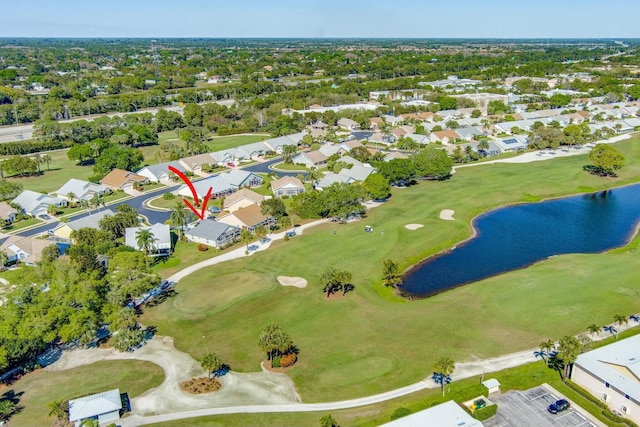 aerial view featuring view of golf course, a water view, and a residential view