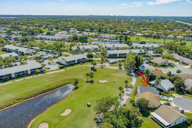 bird's eye view featuring a residential view, a water view, and view of golf course