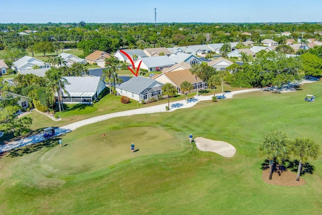 bird's eye view featuring view of golf course and a residential view