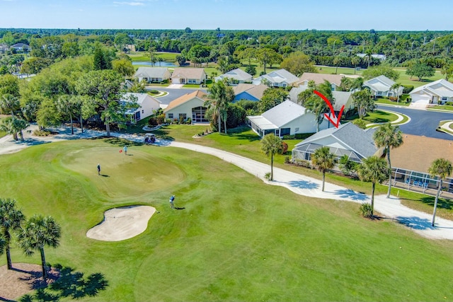 drone / aerial view with a residential view and golf course view