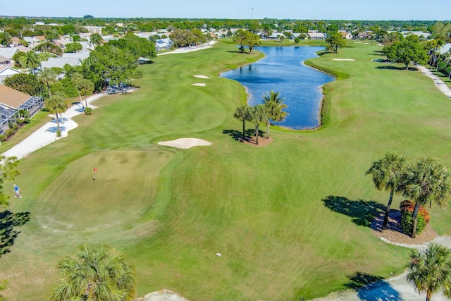 bird's eye view with view of golf course and a water view