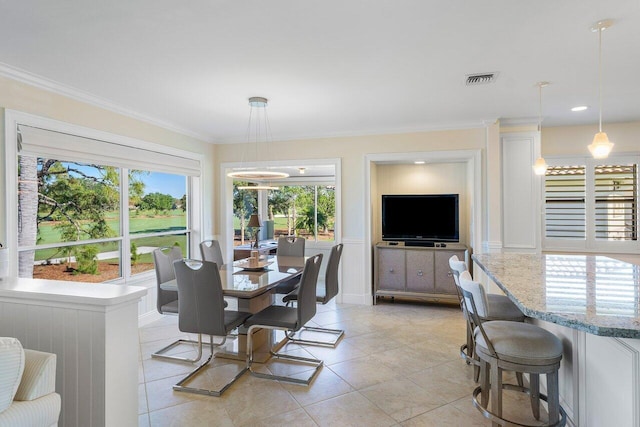 dining area featuring light tile patterned floors, visible vents, and crown molding