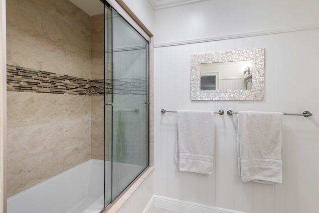 bathroom featuring shower / bath combination with glass door