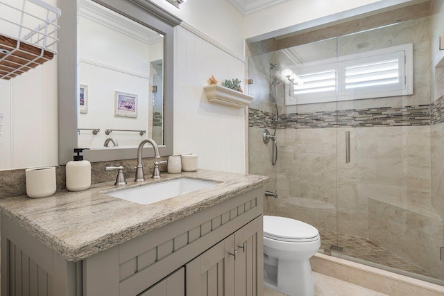 full bath with vanity, toilet, and a shower stall