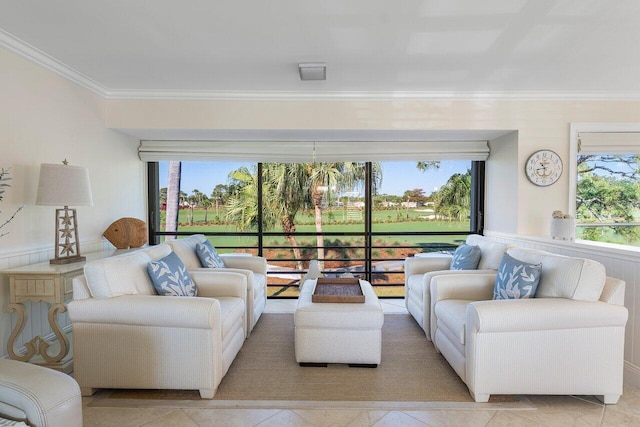 living room with plenty of natural light and ornamental molding