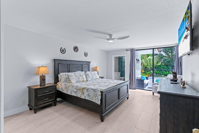 bedroom featuring access to exterior, a textured ceiling, light wood finished floors, baseboards, and ceiling fan