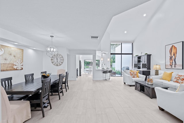 dining area featuring light wood-type flooring, visible vents, a chandelier, and recessed lighting