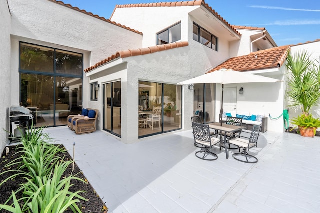 view of patio / terrace with a grill and outdoor dining area