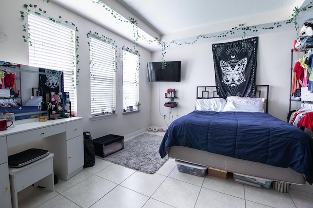 bedroom featuring light tile patterned floors