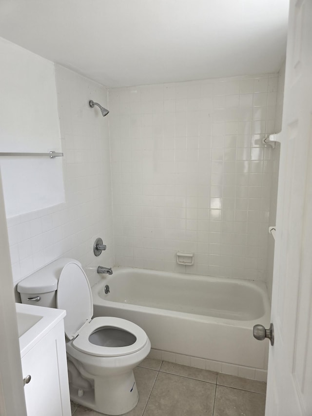 bathroom featuring toilet, tile patterned flooring, bathing tub / shower combination, and vanity