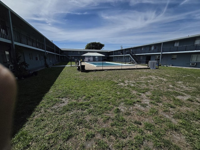 view of yard featuring a fenced in pool