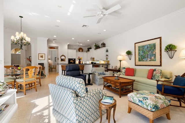 living area with crown molding, light tile patterned floors, ceiling fan with notable chandelier, and visible vents