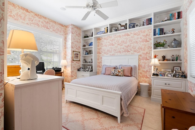 bedroom with light tile patterned floors, wallpapered walls, and ceiling fan