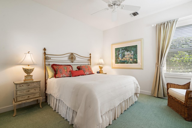 bedroom with a ceiling fan, baseboards, visible vents, and light carpet