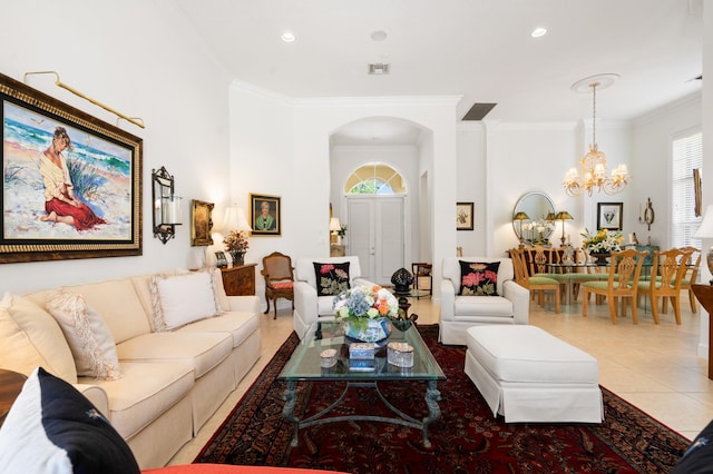 tiled living room with visible vents, ornamental molding, recessed lighting, arched walkways, and a notable chandelier