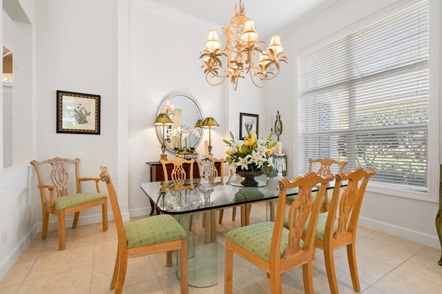 dining space with a notable chandelier, light tile patterned floors, baseboards, and ornamental molding