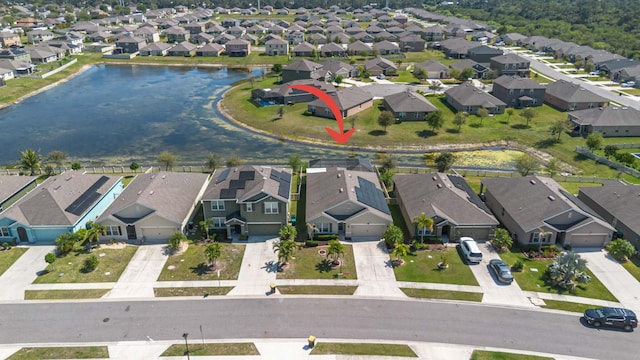 aerial view featuring a residential view and a water view