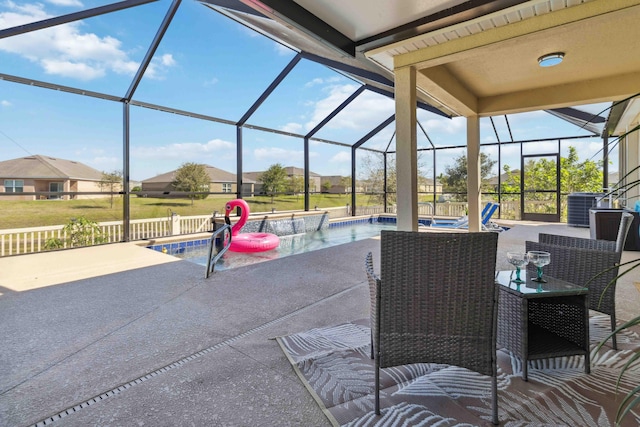 view of patio with a lanai, central AC unit, and an outdoor pool