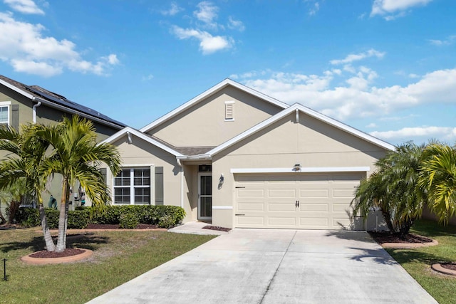 ranch-style home with stucco siding, a front yard, and a garage